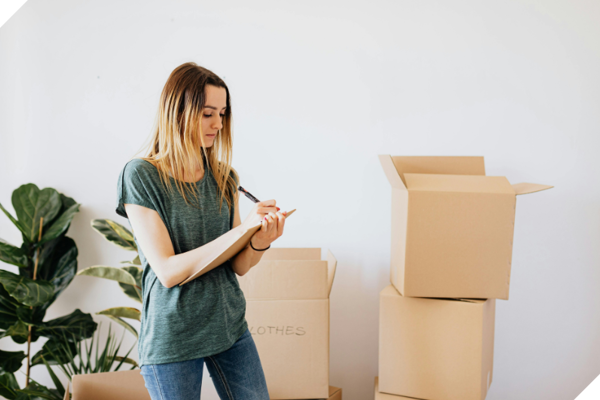 Lady In Room With Boxes CROP