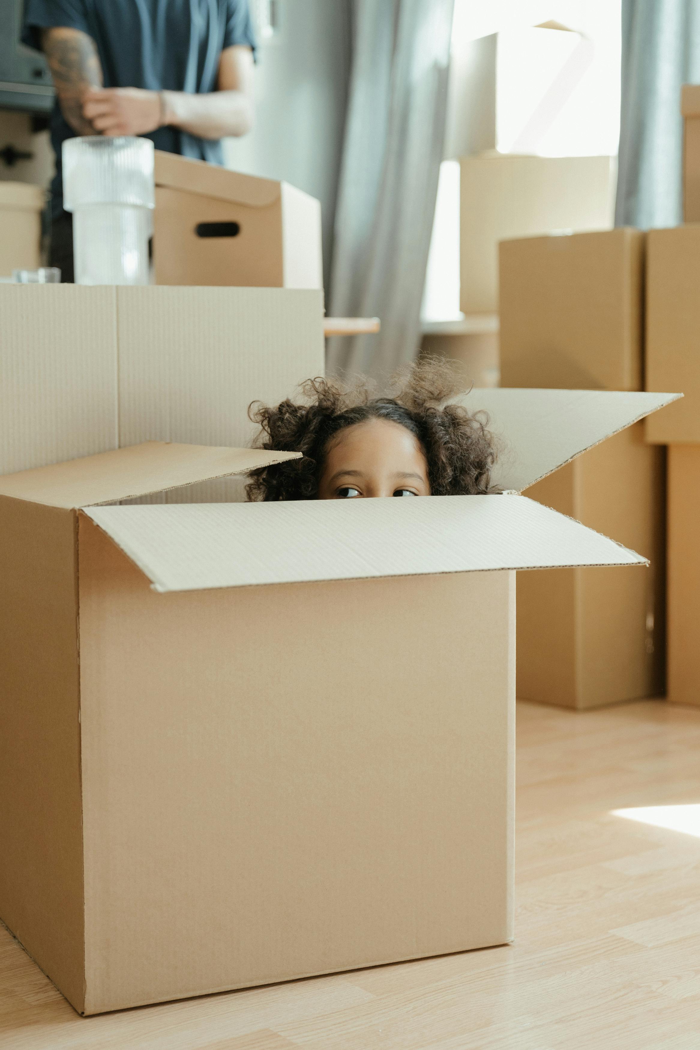 Girl Playing Inside Packing Box Cottonbro